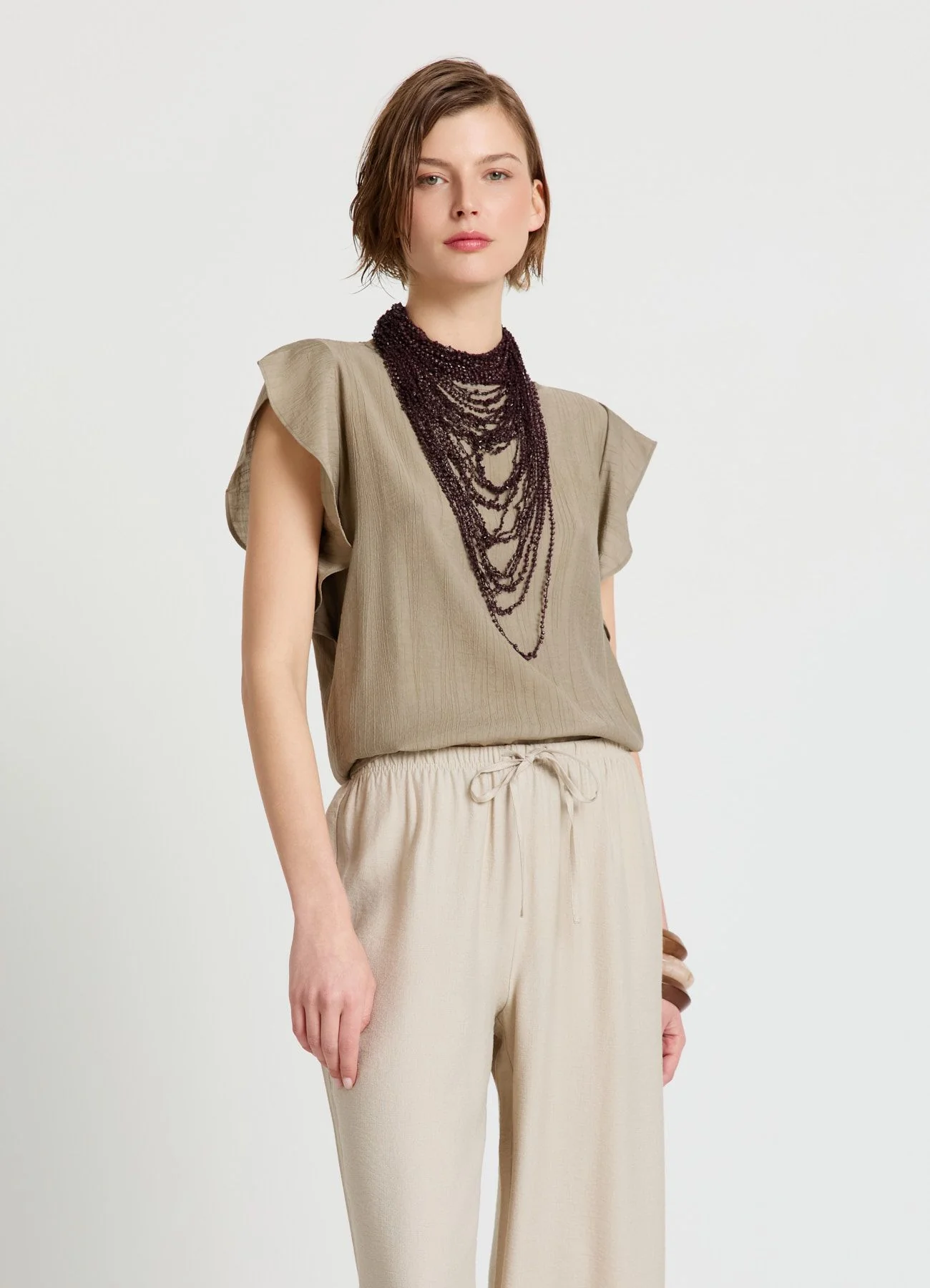 Blusa con maniche a volant