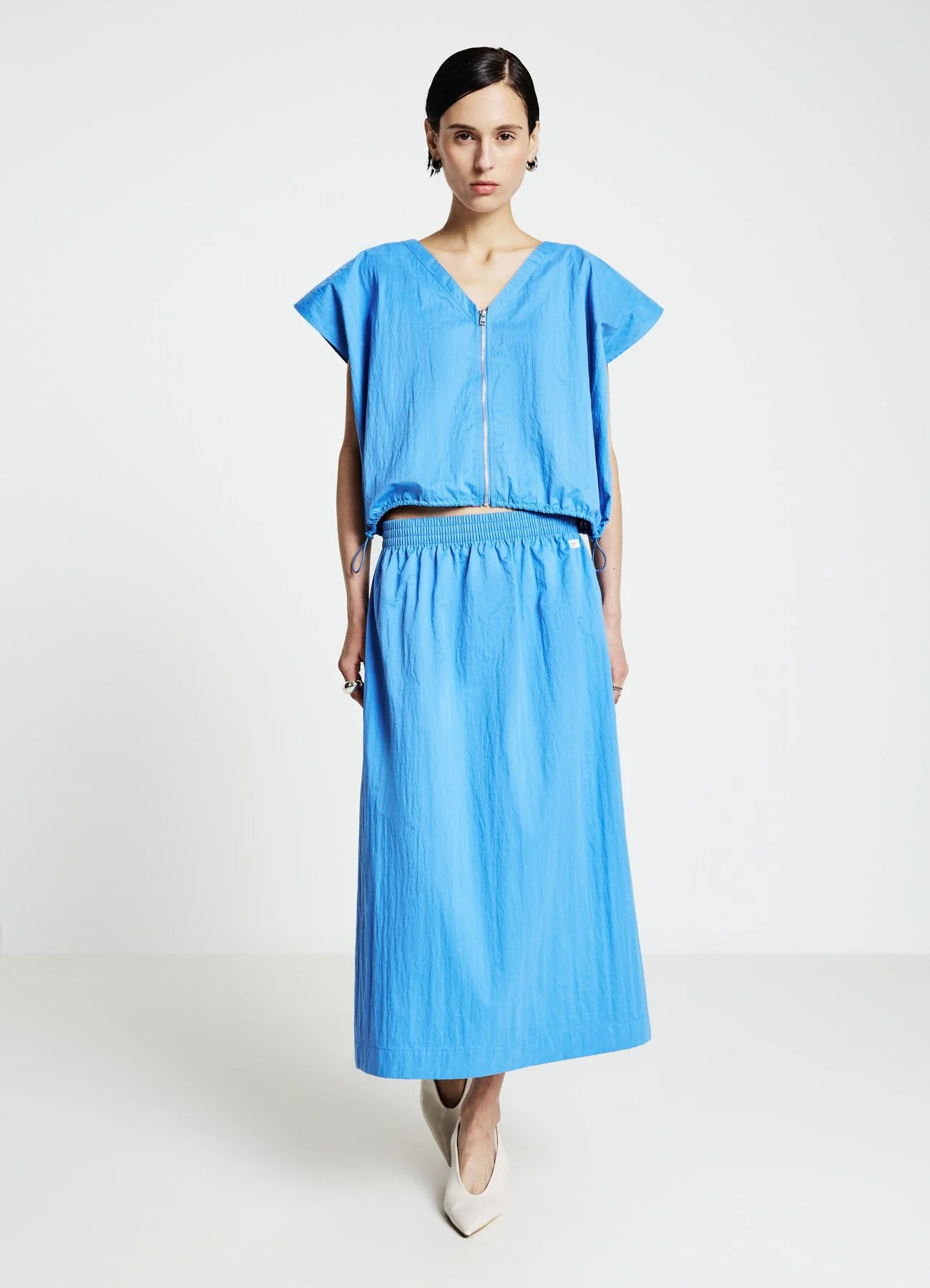 Blusa con zip frontale