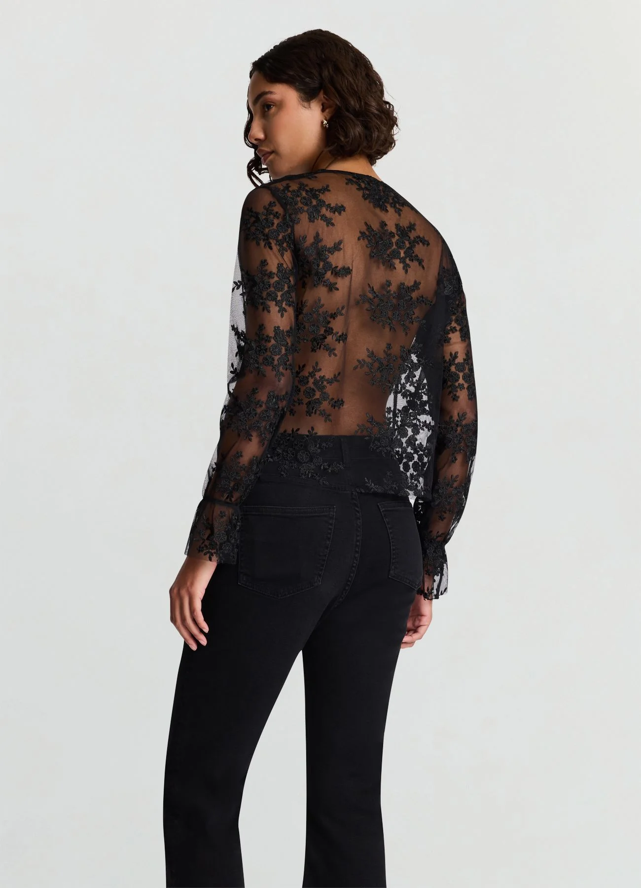 Blusa trasparente con rouches e pizzo