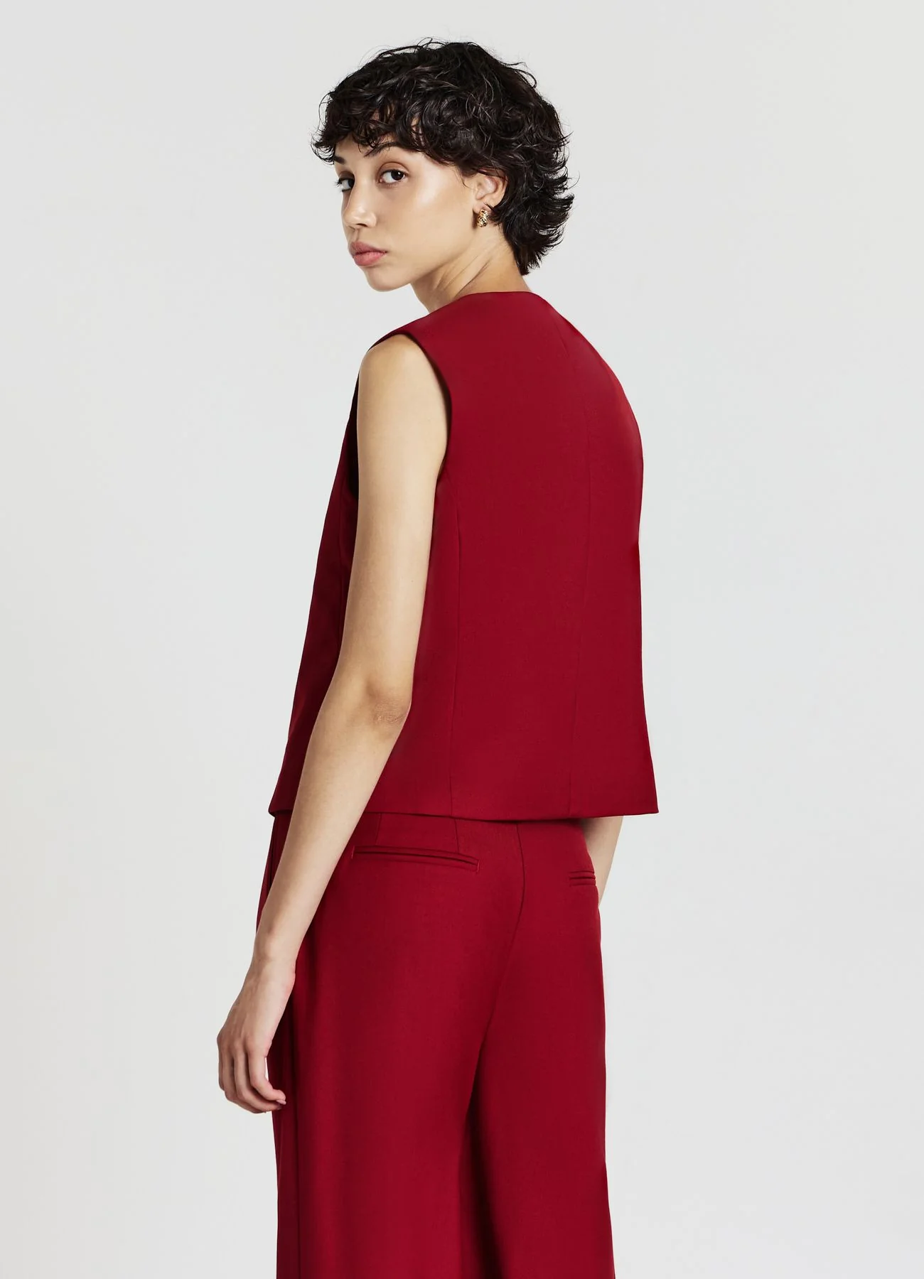 Gilet asimmetrico con bottoni
