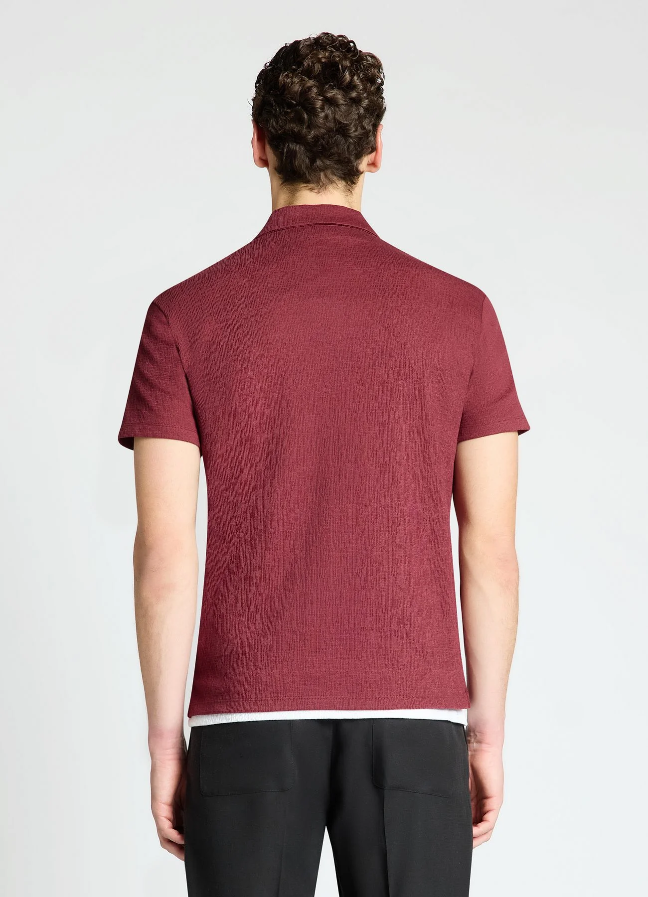 T-shirt polo goffrata a tinta unita